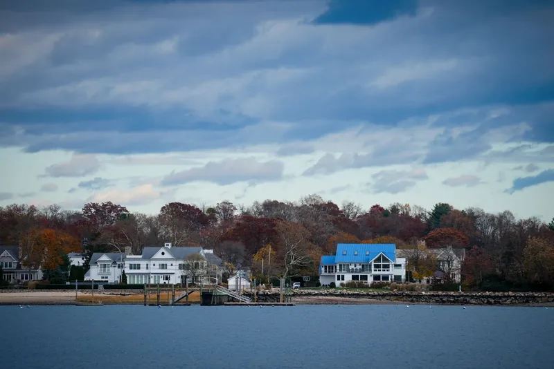 Waterfront homes along the Connecticut shore in autumn.